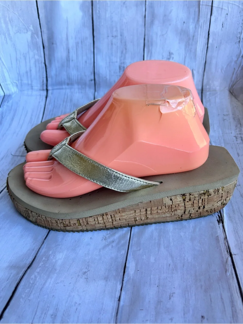 Volatile Gold thong wedge sandals with a cork platform,